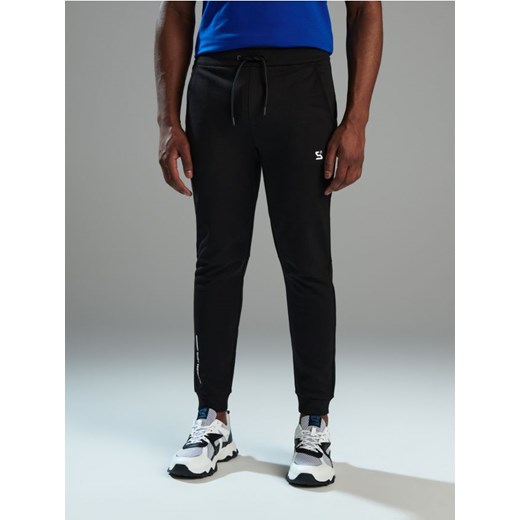 Sinsay - Spodnie dresowe SNSY PERFORMANCE - czarny ze sklepu Sinsay w kategorii Spodnie męskie - zdjęcie 169199190