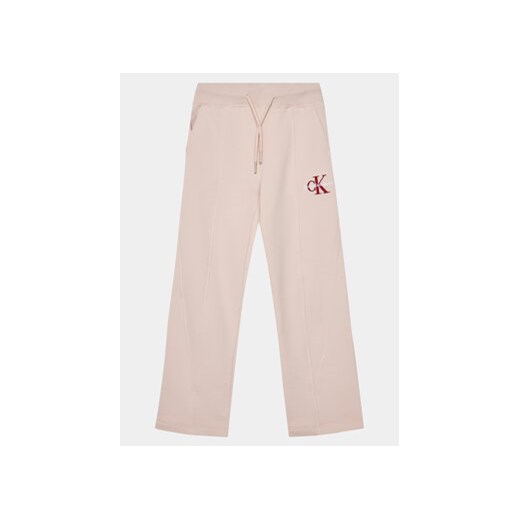 Calvin Klein Jeans Spodnie dresowe Monogram IG0IG02448 Różowy Relaxed Fit ze sklepu MODIVO w kategorii Spodnie dziewczęce - zdjęcie 169204910