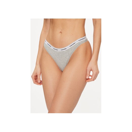 Calvin Klein Underwear Stringi 000QD5043E Szary ze sklepu MODIVO w kategorii Majtki damskie - zdjęcie 169225171