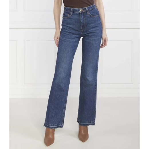 Granatowe jeansy damskie Guess 