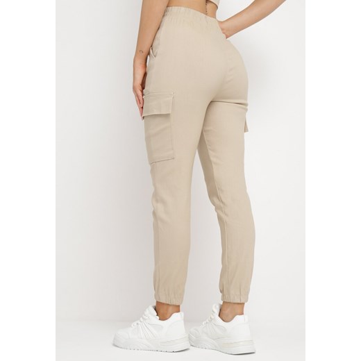 Spodnie damskie beżowe Born2be w sportowym stylu 