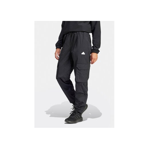 adidas Spodnie dresowe City Escape IQ4826 Czarny Loose Fit ze sklepu MODIVO w kategorii Spodnie damskie - zdjęcie 169417911