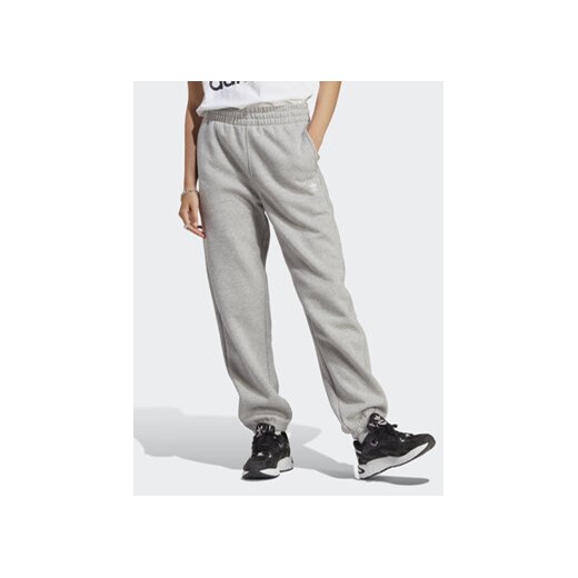 adidas Spodnie dresowe Essentials Fleece IA6432 Szary Regular Fit ze sklepu MODIVO w kategorii Spodnie damskie - zdjęcie 169423351
