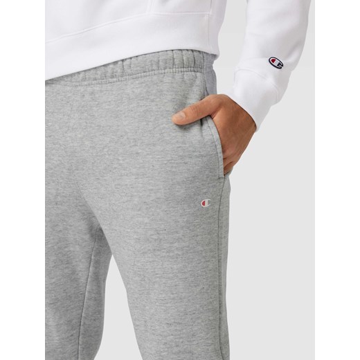 Spodnie dresowe o kroju regular fit z elastycznym pasem Champion L Peek&Cloppenburg 