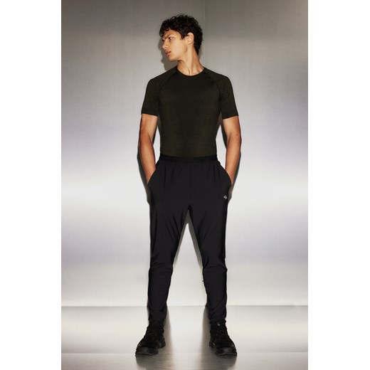 H & M - Spodnie z czterokierunkowym stretchem DryMove - Czarny ze sklepu H&M w kategorii Spodnie męskie - zdjęcie 169599223