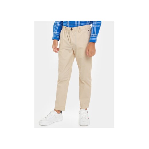 Tommy Hilfiger Spodnie materiałowe KB0KB08895 Beżowy Regular Fit ze sklepu MODIVO w kategorii Spodnie chłopięce - zdjęcie 169634773