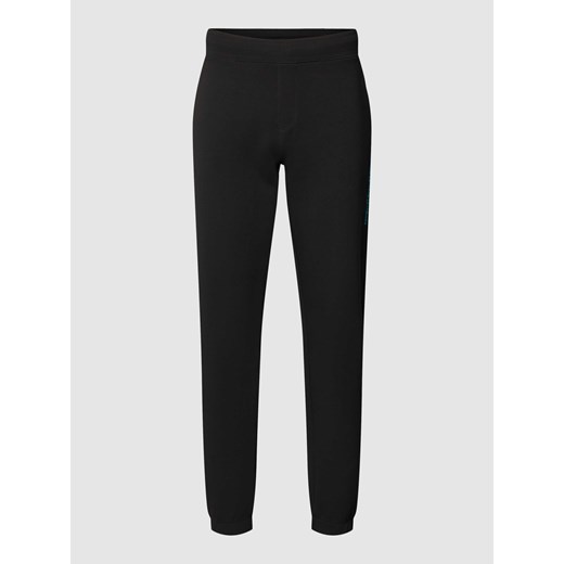 Spodnie dresowe o kroju comfort fit w jednolitym kolorze ze sklepu Peek&Cloppenburg  w kategorii Spodnie męskie - zdjęcie 169652421