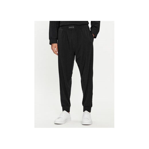Calvin Klein Underwear Spodnie dresowe 000NM2571E Czarny Regular Fit ze sklepu MODIVO w kategorii Spodnie męskie - zdjęcie 169658242