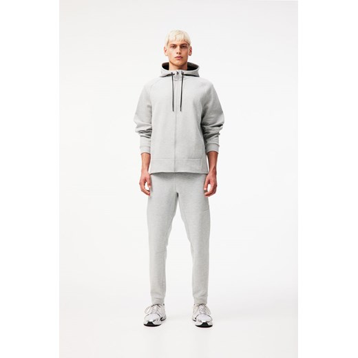 H & M - Zwężane joggersy techniczne z kieszeniami DryMove - Szary H & M M H&M
