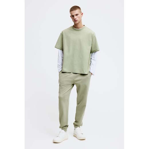 H & M - Spodnie dresowe Regular Fit - Zielony H & M L H&M