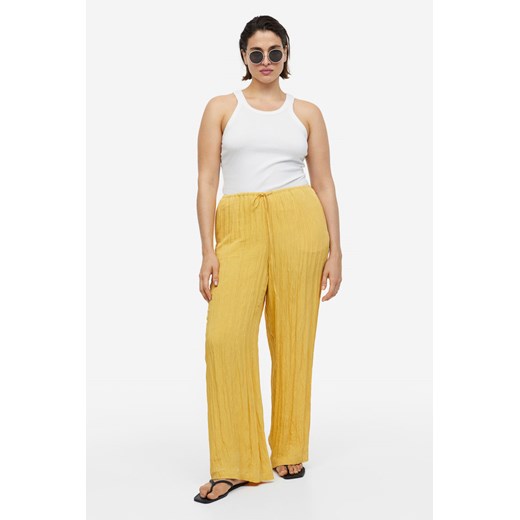 H & M - Szerokie spodnie bez zapięcia - Żółty H & M S H&M