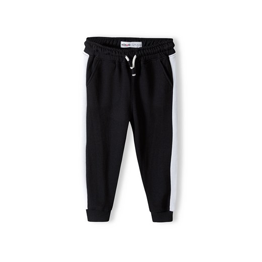 Czarne spodnie dresowe dziewczęce z paskami ze sklepu 5.10.15 w kategorii Spodnie dziewczęce - zdjęcie 169691422