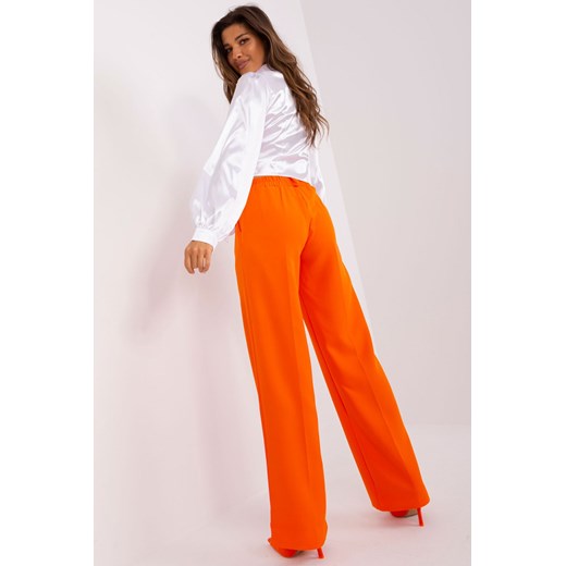Pomarańczowe garniturowe spodnie z kieszeniami Lakerta 38 5.10.15