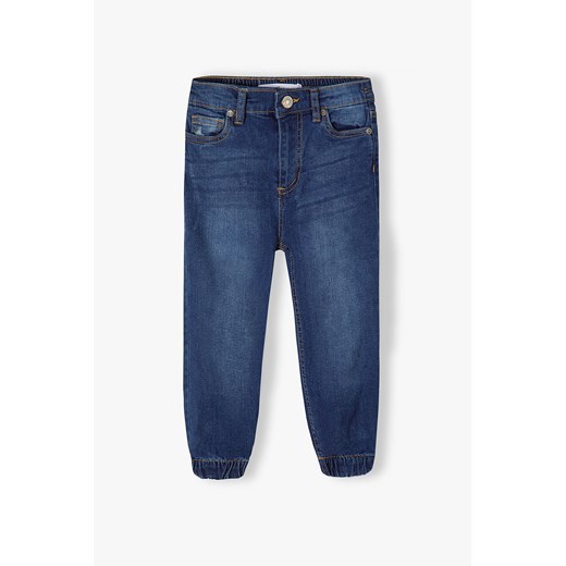 Ciemne spodnie jeansowe typu joggery dziewczęce ze sklepu 5.10.15 w kategorii Spodnie dziewczęce - zdjęcie 169695244