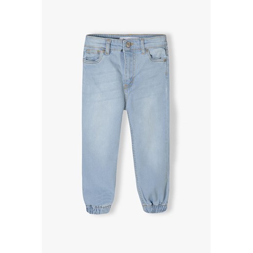 Jasne spodnie jeansowe typu joggery dziewczęce ze sklepu 5.10.15 w kategorii Spodnie dziewczęce - zdjęcie 169700152