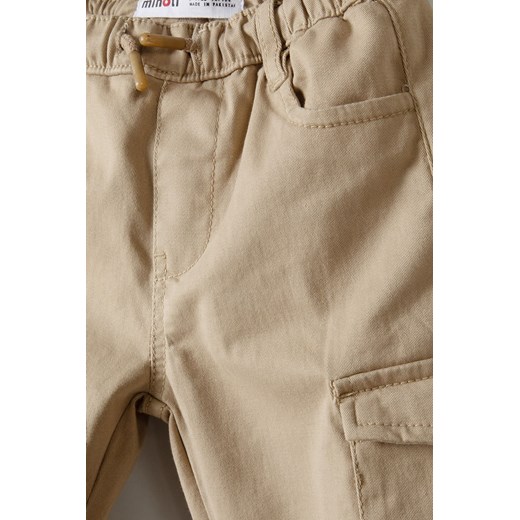 Beżowe spodnie typu bojówki dla niemowlaka Minoti 80/86 wyprzedaż 5.10.15
