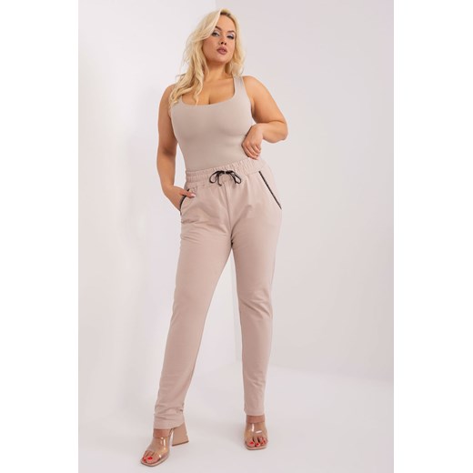 Dresowe spodnie plus size z troczkami beżowy ze sklepu 5.10.15 w kategorii Spodnie damskie - zdjęcie 169716560