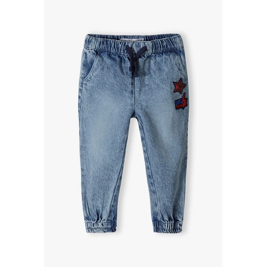 Spodnie jeansowe dziewczęce typu jogger z gwiazdką ze sklepu 5.10.15 w kategorii Spodnie dziewczęce - zdjęcie 169717344