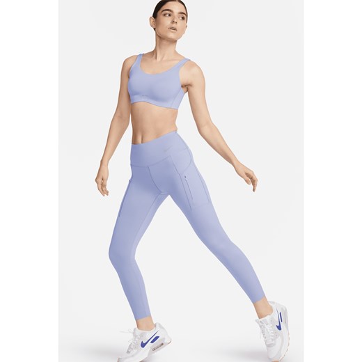 Damskie legginsy ze średnim stanem i kieszeniami o długości 7/8 zapewniające mocne wsparcie Nike Go - Fiolet ze sklepu Nike poland w kategorii Spodnie damskie - zdjęcie 169754844