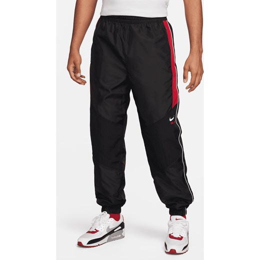 Męskie spodnie z tkaniny Nike Air - Czerń ze sklepu Nike poland w kategorii Spodnie męskie - zdjęcie 169754991