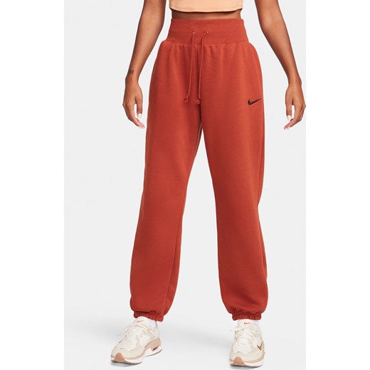 Damskie spodnie dresowe o kroju oversize z wysokim stanem Nike Sportswear Phoenix Fleece - Pomarańczowy ze sklepu Nike poland w kategorii Spodnie damskie - zdjęcie 169755501
