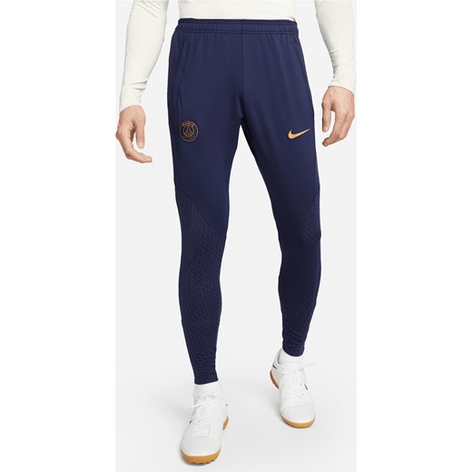 Męskie dzianinowe spodnie piłkarskie Paris Saint-Germain Strike Nike Dri-FIT - Niebieski ze sklepu Nike poland w kategorii Spodnie męskie - zdjęcie 169755783