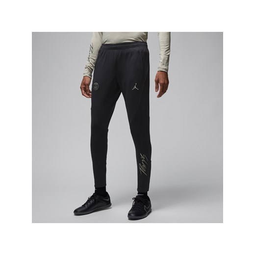 Męskie dzianinowe spodnie piłkarskie Jordan Dri-FIT Paris Saint-Germain Strike (wersja trzecia) - Czerń ze sklepu Nike poland w kategorii Spodnie męskie - zdjęcie 169756280
