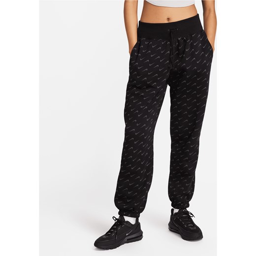 Damskie spodnie dresowe o kroju oversize z nadrukiem Nike Sportswear Phoenix Fleece - Czerń ze sklepu Nike poland w kategorii Spodnie damskie - zdjęcie 169756393