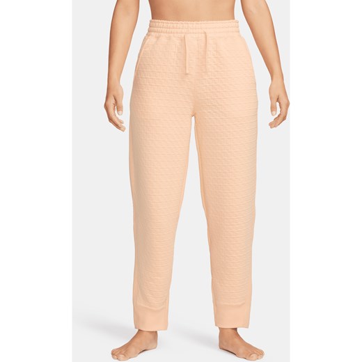 Damskie spodnie o kroju oversize z wysokim stanem Nike Yoga Therma-FIT - Pomarańczowy ze sklepu Nike poland w kategorii Spodnie damskie - zdjęcie 169756733