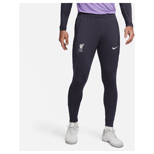 Męskie spodnie piłkarskie z dzianiny Nike Dri-FIT Liverpool F.C. Strike (wersja trzecia) - Szary ze sklepu Nike poland w kategorii Spodnie męskie - zdjęcie 169757244
