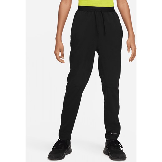 Spodnie treningowe dla dużych dzieci (chłopców) Dri-FIT Nike Multi Tech EasyOn - Czerń ze sklepu Nike poland w kategorii Spodnie męskie - zdjęcie 169758131