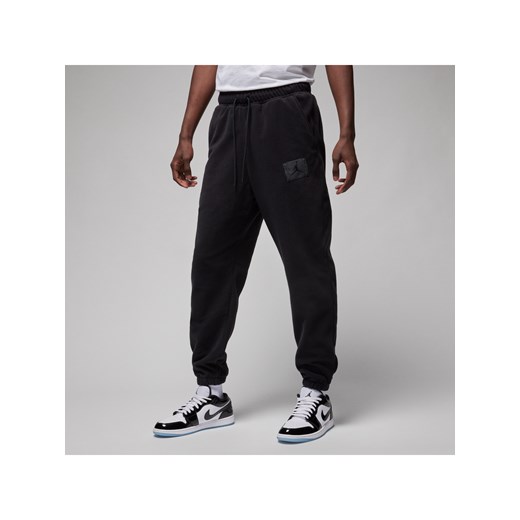 Męskie spodnie zimowe z dzianiny Jordan Essentials - Czerń ze sklepu Nike poland w kategorii Spodnie męskie - zdjęcie 169758283