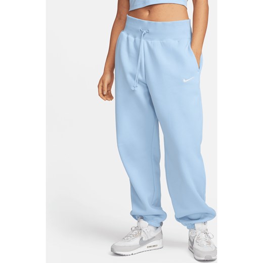 Damskie spodnie dresowe o kroju oversize z wysokim stanem Nike Sportswear Phoenix Fleece - Niebieski ze sklepu Nike poland w kategorii Spodnie damskie - zdjęcie 169758862