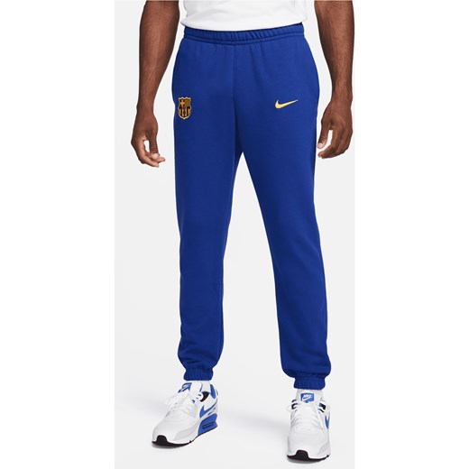Męskie spodnie z dzianiny dresowej Nike Football FC Barcelona Club - Niebieski ze sklepu Nike poland w kategorii Spodnie męskie - zdjęcie 169759011