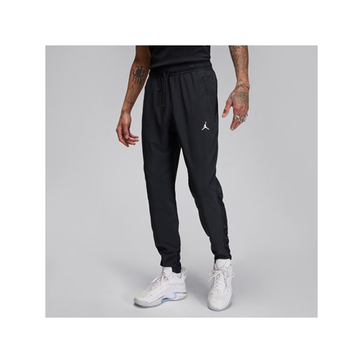 Męskie spodnie z tkaniny Dri-FIT Jordan Sport - Czerń ze sklepu Nike poland w kategorii Spodnie męskie - zdjęcie 169759084