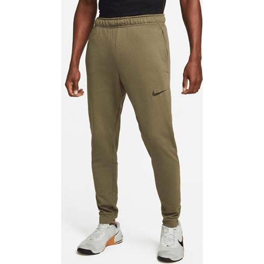 Męskie zwężane spodnie do fitnessu z dzianiny Dri-FIT Nike Dry - Zieleń ze sklepu Nike poland w kategorii Spodnie męskie - zdjęcie 169759311