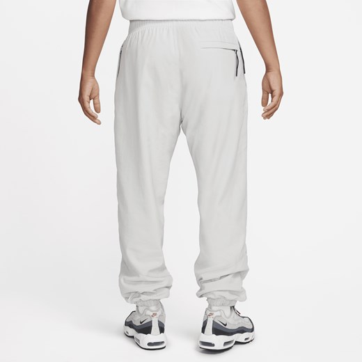 Męskie spodnie z tkaniny na zimę Nike Windrunner - Szary Nike XL okazyjna cena Nike poland