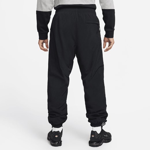 Męskie spodnie z tkaniny na zimę Nike Windrunner - Czerń Nike S Nike poland