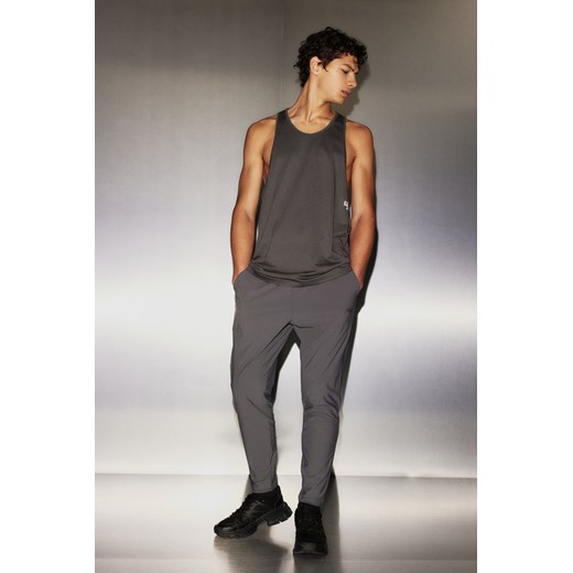 H & M - Spodnie z czterokierunkowym stretchem DryMove - Szary ze sklepu H&M w kategorii Spodnie męskie - zdjęcie 169871810