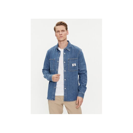 Calvin Klein Jeans Koszula jeansowa Linear J30J324885 Niebieski Slim Fit ze sklepu MODIVO w kategorii Koszule męskie - zdjęcie 170009291