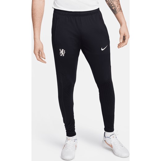 Męskie spodnie piłkarskie Nike Dri-FIT Chelsea F.C. Strike - Niebieski ze sklepu Nike poland w kategorii Spodnie męskie - zdjęcie 170057474