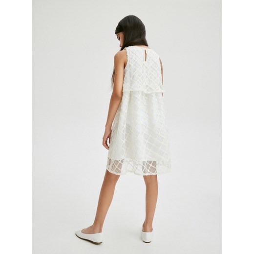 Reserved - Błyszcząca sukienka z cekinami - złamana biel Reserved 128 (7-8 lat) Reserved