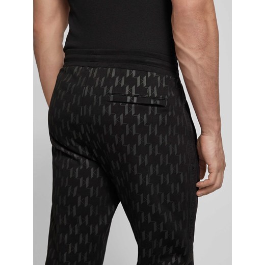 Spodnie dresowe o kroju regular fit z nadrukiem z logo na całej powierzchni Karl Lagerfeld M Peek&Cloppenburg 