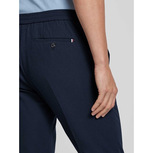 Spodnie materiałowe o kroju regular fit z fakturowanym wzorem model ‘HARLEM’ Tommy Hilfiger 32/32 Peek&Cloppenburg 