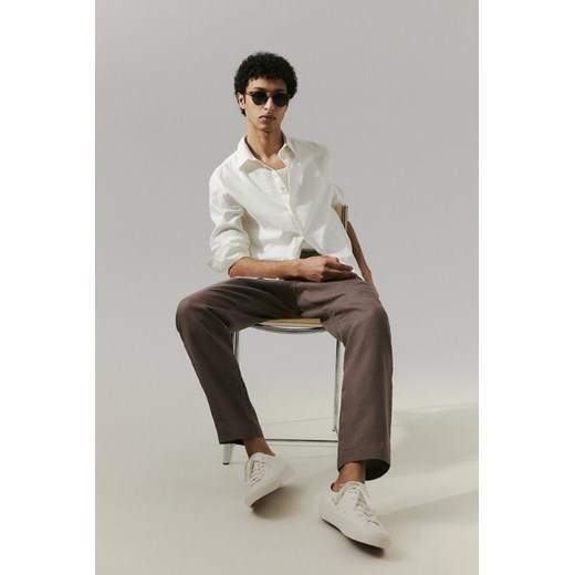 H & M - Lniane spodnie Regular Fit - Beżowy ze sklepu H&M w kategorii Spodnie męskie - zdjęcie 170274363
