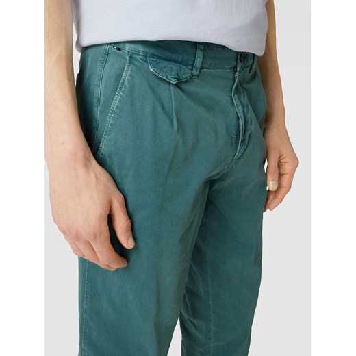 Spodnie z zakładkami w pasie model ‘CHELSEA’ Tommy Hilfiger 33/32 Peek&Cloppenburg  promocja