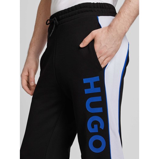 NOWOŚĆ w P&C: Spodnie dresowe o kroju regular fit model ‘Narlos’ Hugo Blue S Peek&Cloppenburg 