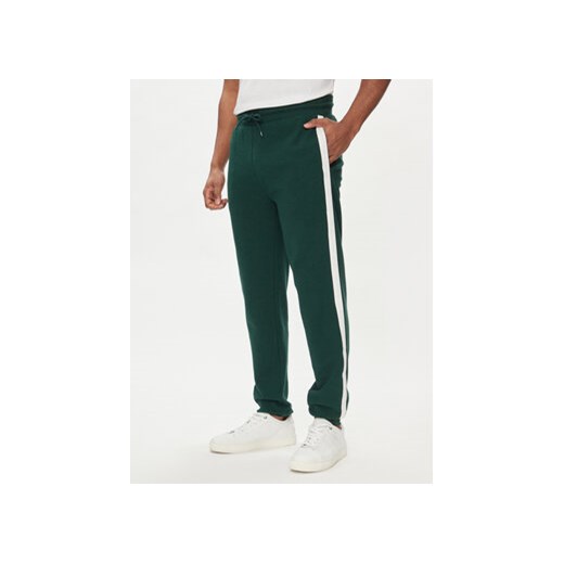 Tommy Hilfiger Spodnie dresowe UM0UM03013 Zielony Regular Fit ze sklepu MODIVO w kategorii Spodnie męskie - zdjęcie 170425281