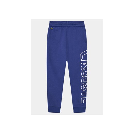 Lacoste Spodnie dresowe XJ6901 Niebieski Relaxed Fit ze sklepu MODIVO w kategorii Spodnie chłopięce - zdjęcie 170468233