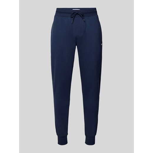 Spodnie dresowe o kroju slim fit z efektem melanżowym ze sklepu Peek&Cloppenburg  w kategorii Spodnie męskie - zdjęcie 170530653